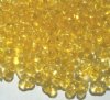 25 grams of 3x7mm Transparent Yellow Farfalle Seed Beads
